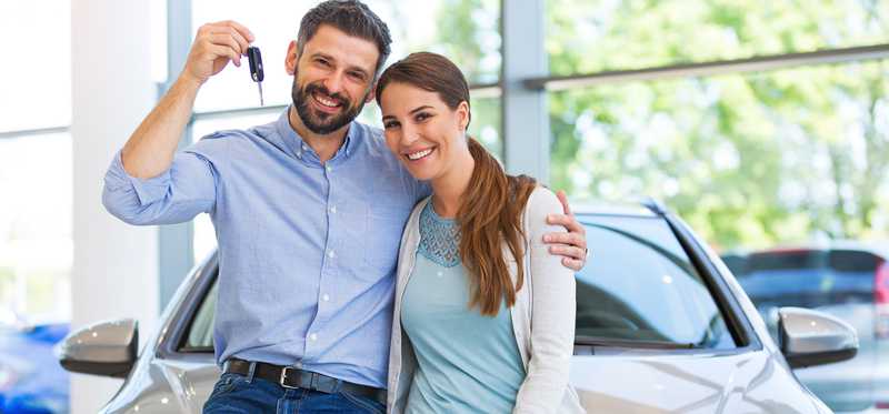 A couple buying a new car.
