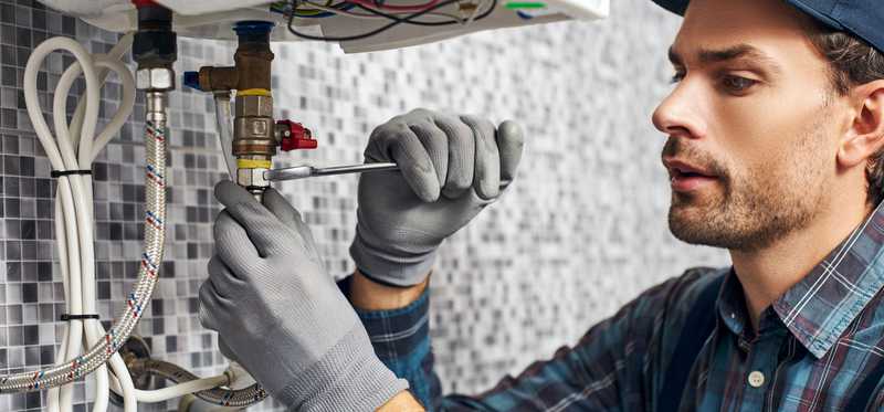 Person working on pipe.