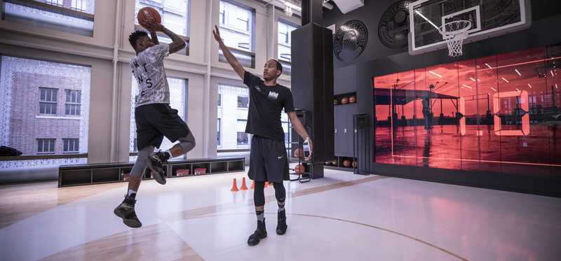 Basketball players on an indoor court.