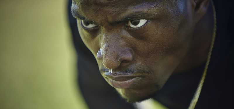 Man focusing at the start of a race on a track