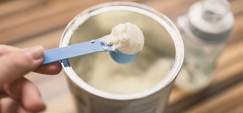 A scoop of powdered baby formula.