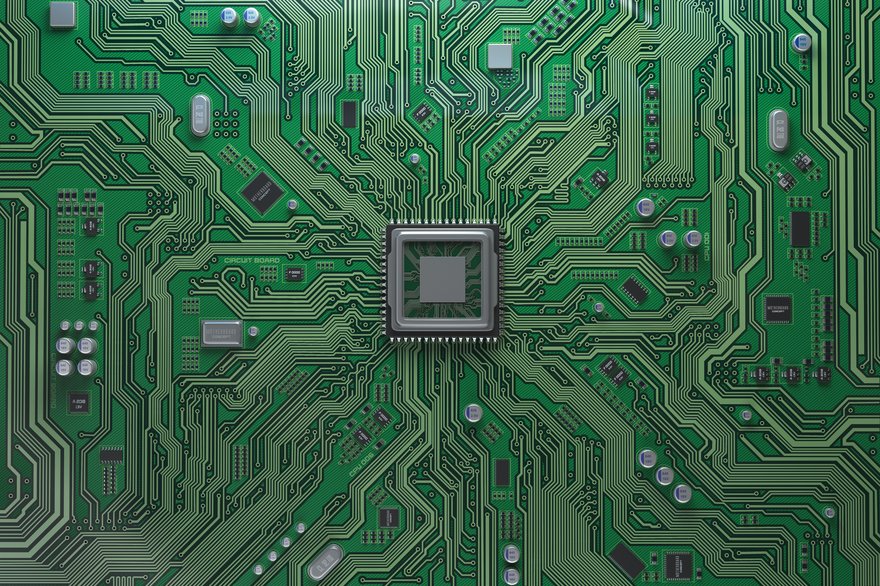 A semiconductor chip on green board.