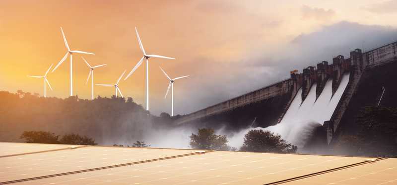 Solar panels, a hydro dam, and wind turbines.
