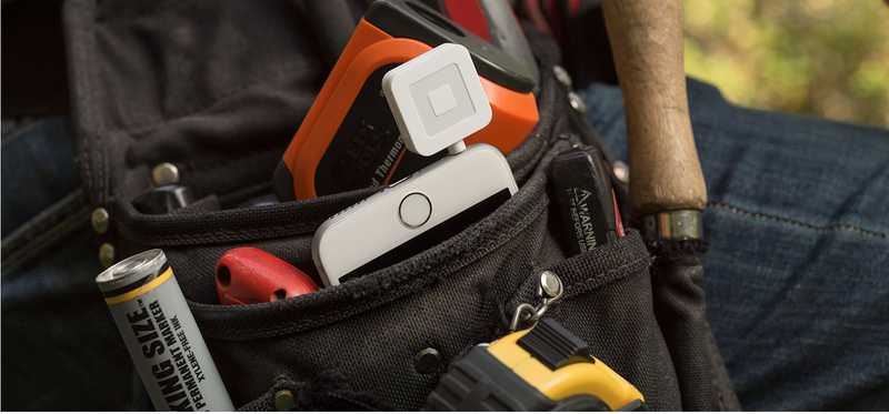 Square device in pants pocket of worker