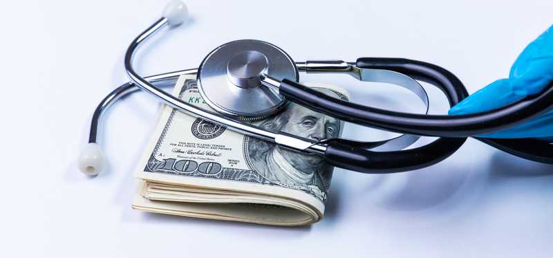 Stethoscope on folded bills