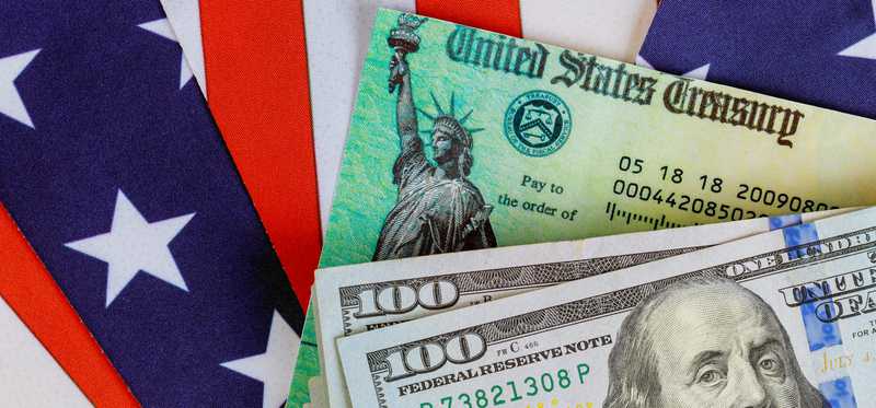 Stimulus check with hundred dollar bills