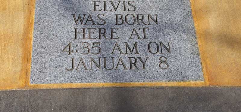 A stone memorial marking Elvis Presley's birthplace in Tupelo, Mississippi.