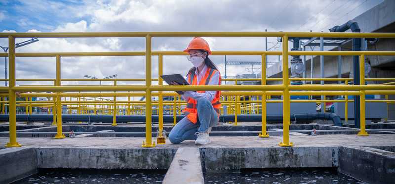 A technician working at a wastewater treatment plant.