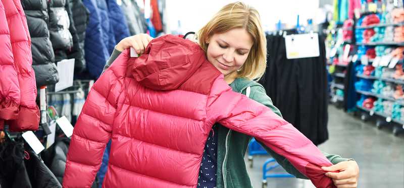 A customer shopping for a winter coat.