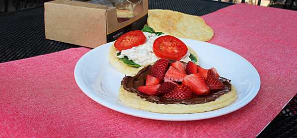 Walmart's Crotilla with chocolate sauce and strawberries on a pink tablecloth.