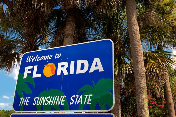 Highway sign that says Welcome to Florida, the Sunshine State.