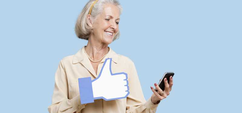 Woman with a social media like and a smartphone