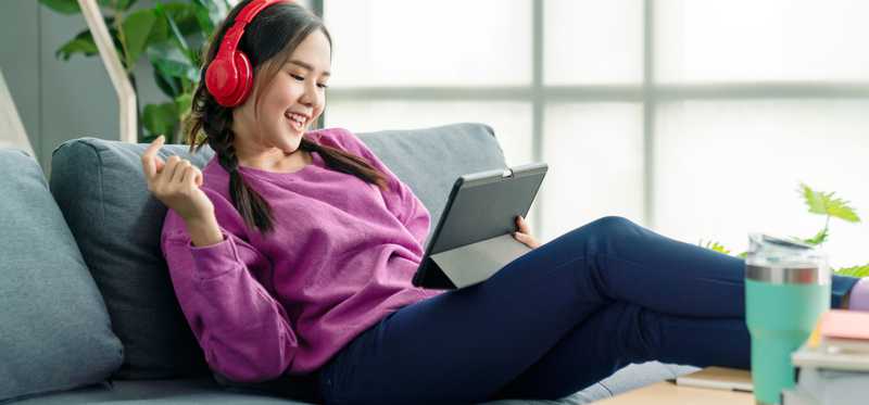 Woman listening to music on headphones