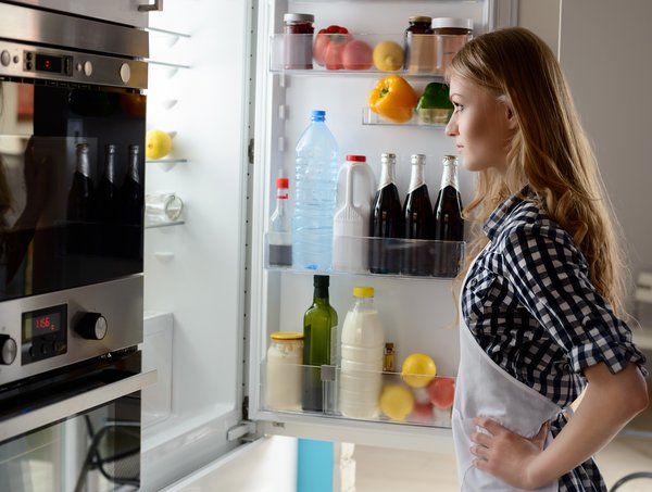 Person looking inside a refrigerator.