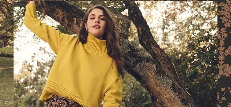 Woman wearing sweater for Ann Taylor