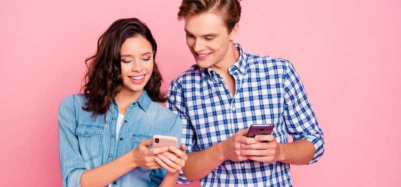 Young couple with smartphones