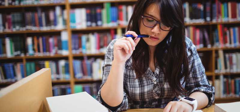 Person studying in a library.