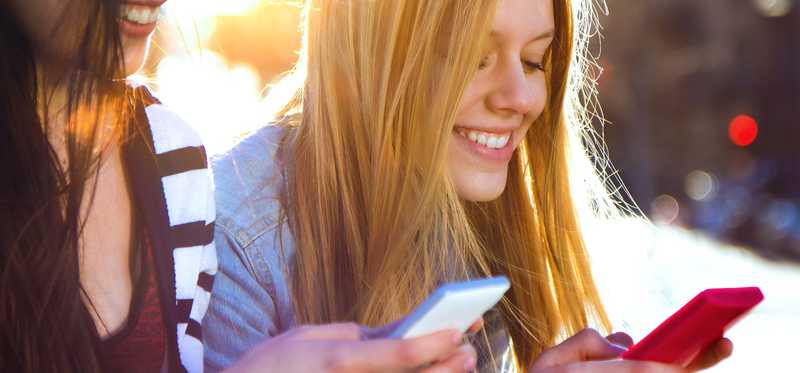 Young women using smartphones.