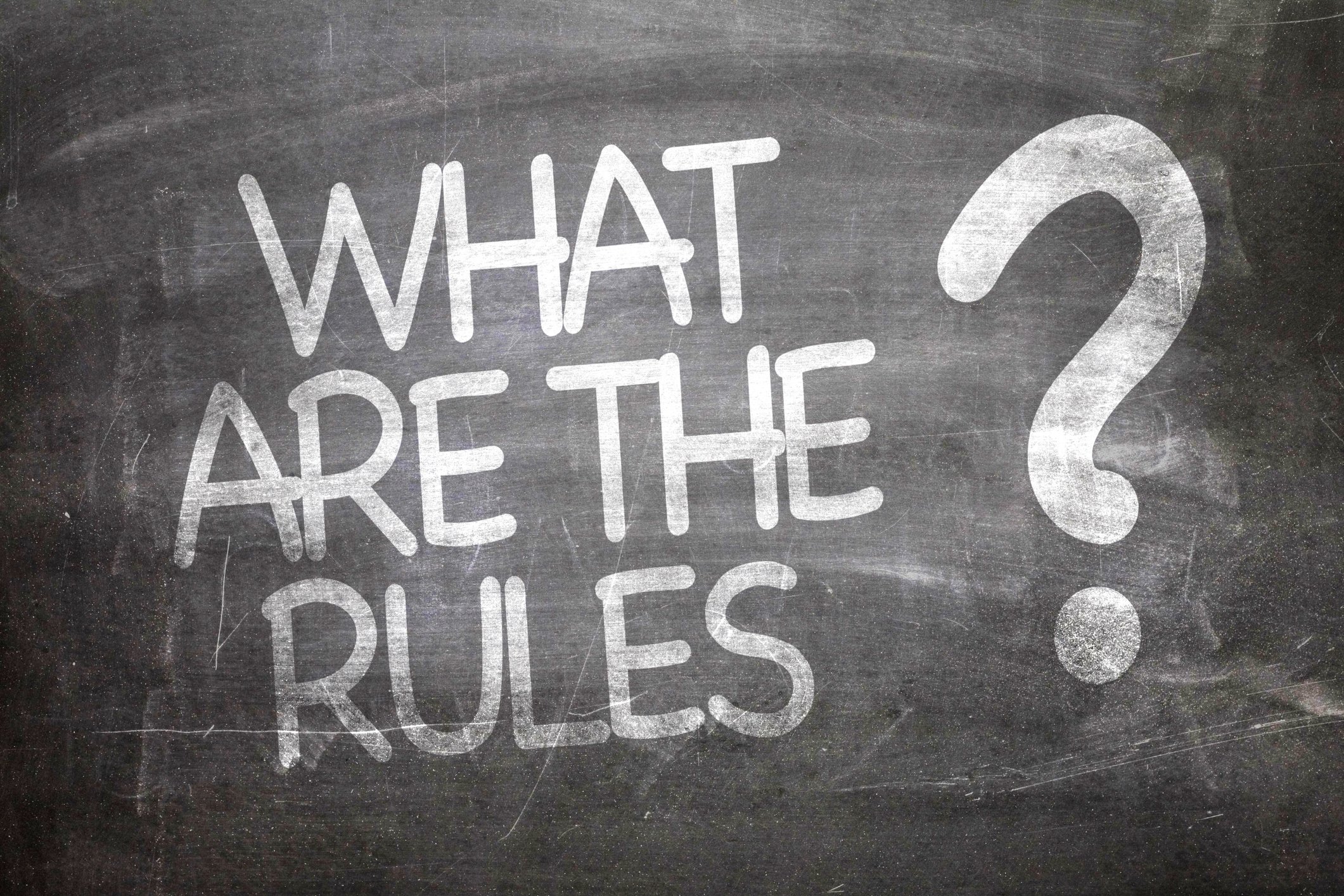 What are the rules is written in chalk on a blackboard.