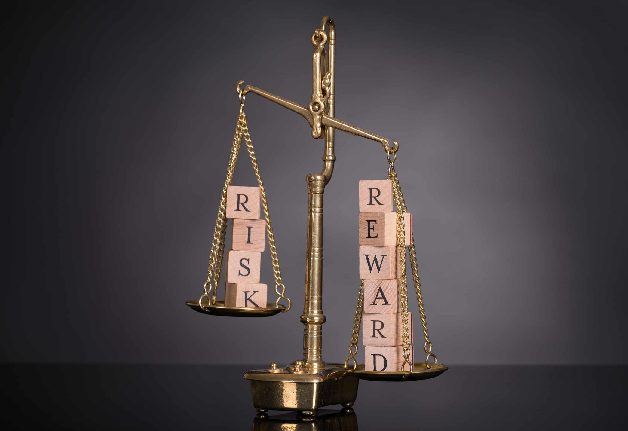 A scale weighing risk and reward.