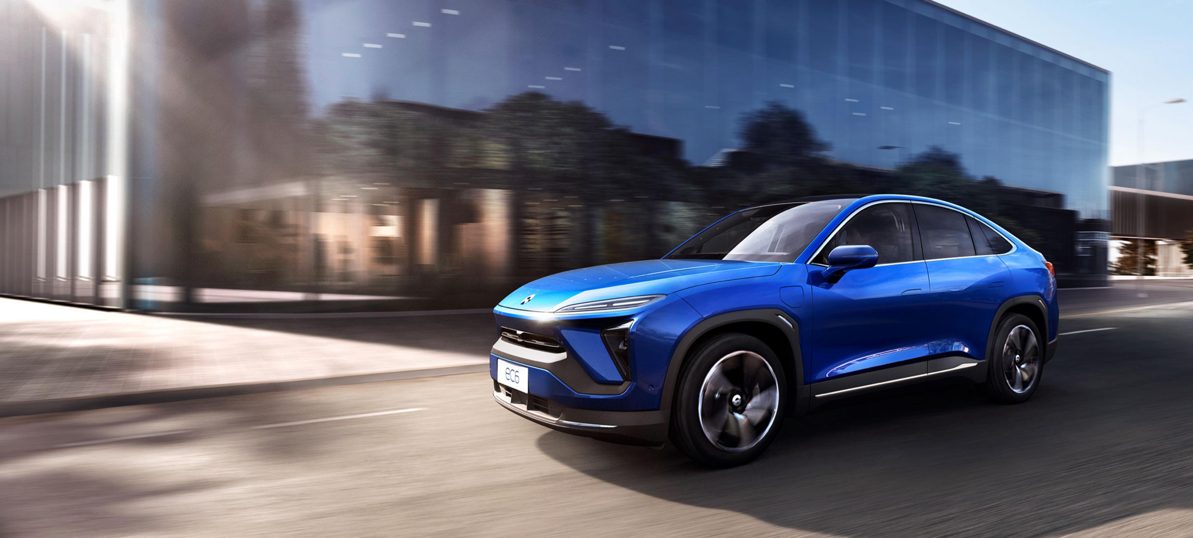 NIO E6 coupe NIO E6 coupe driving on city street.