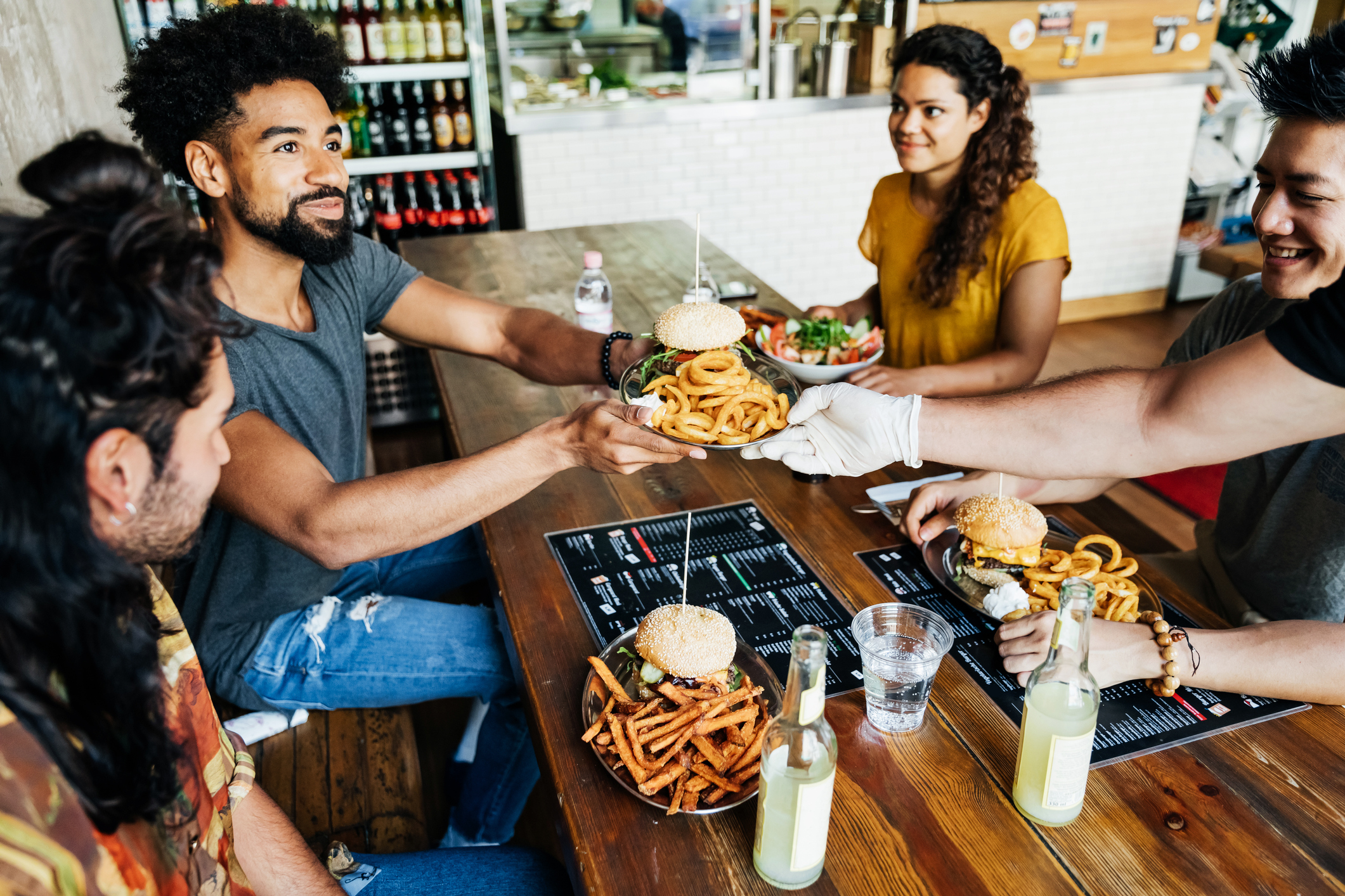 A group of people eating at a restaurant.