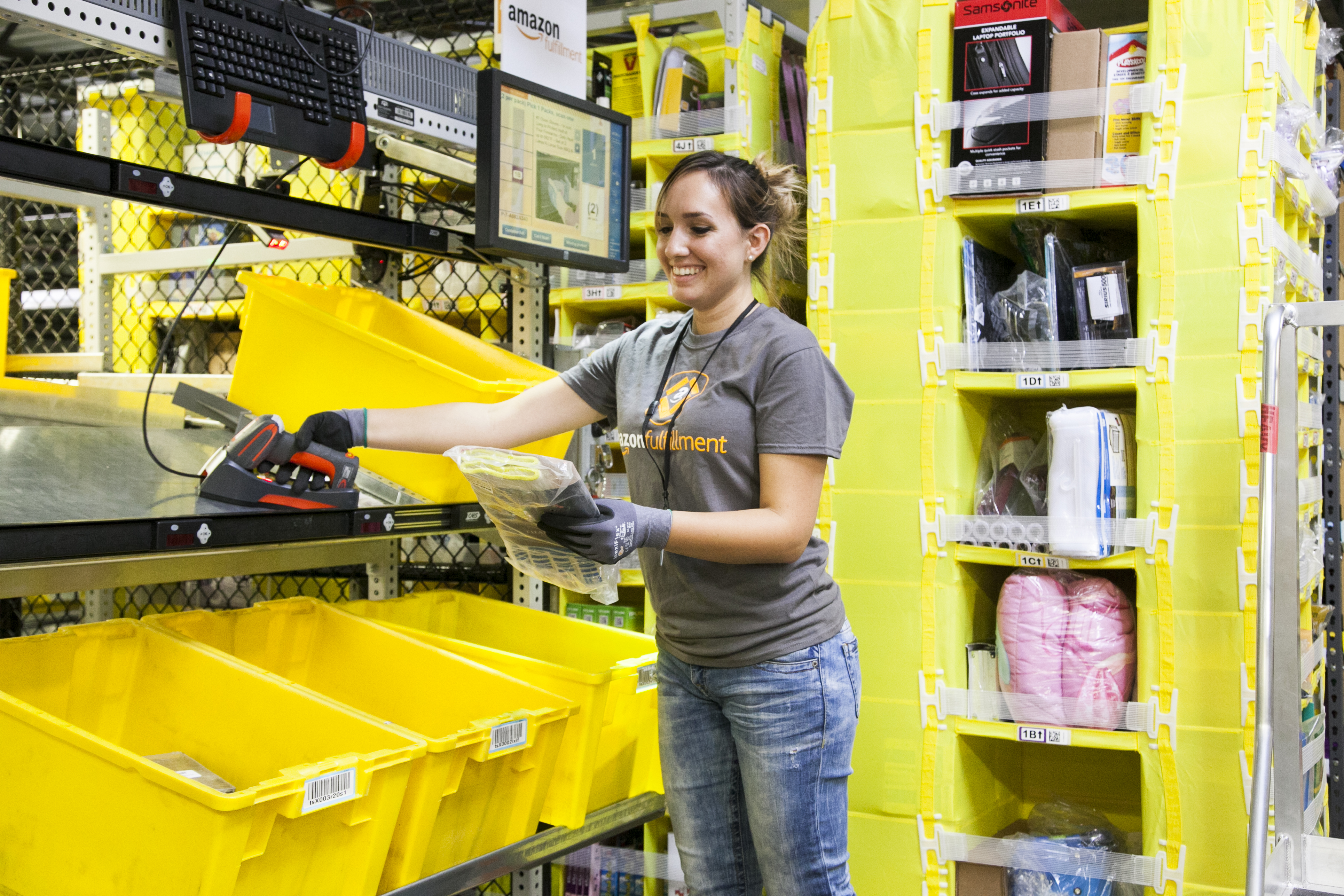 A female worker in an Amazon fulfillment center.