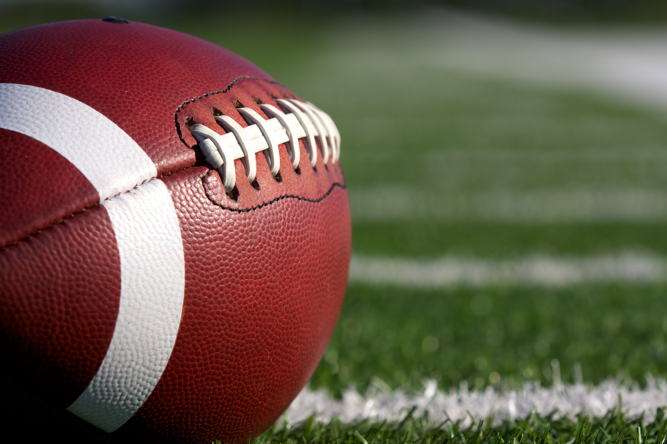American football sitting on football field American football sitting on a football field.