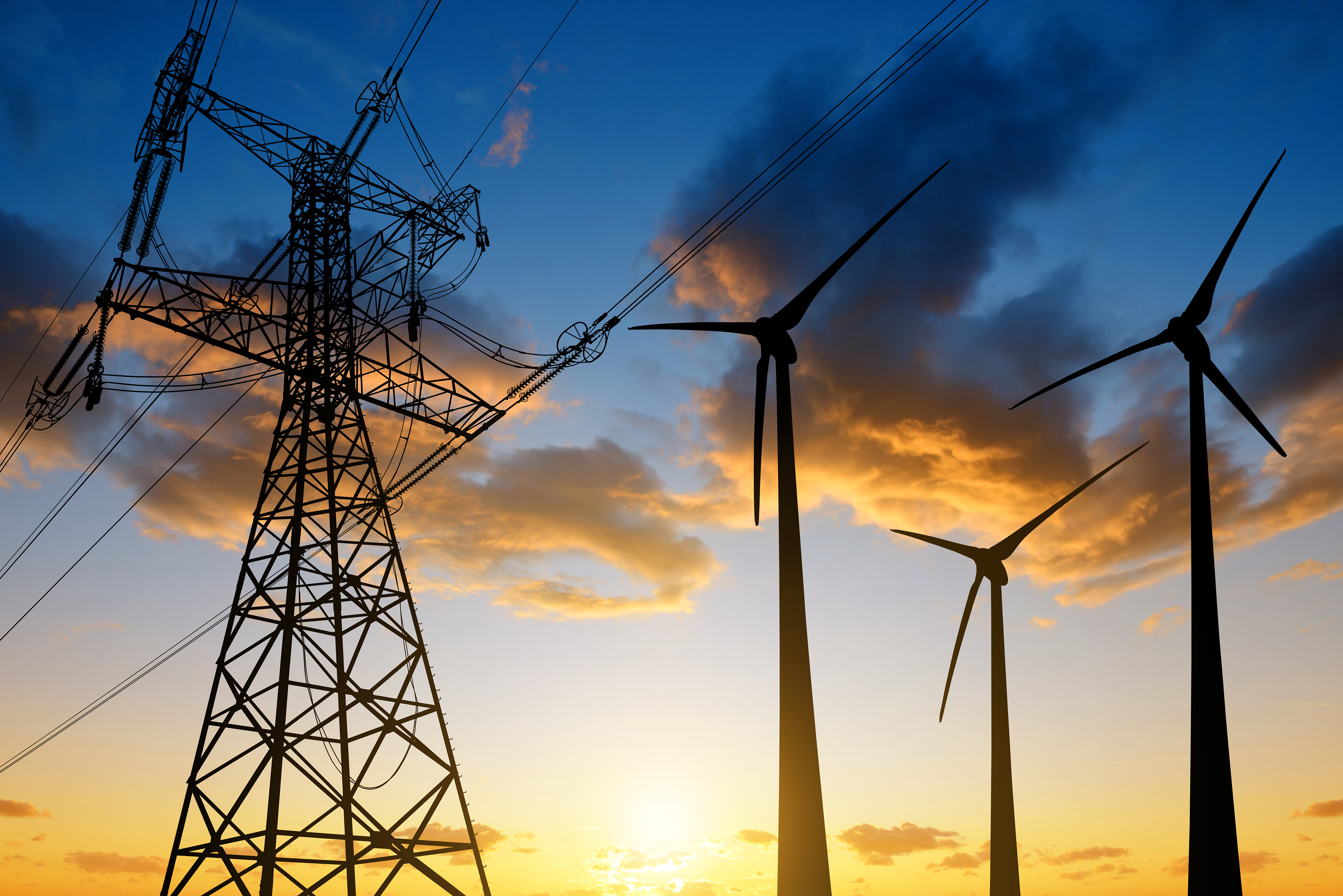 power generation, wind turbines, electricity, renewable energy An electrical grid next to three wind turbines at sunset.