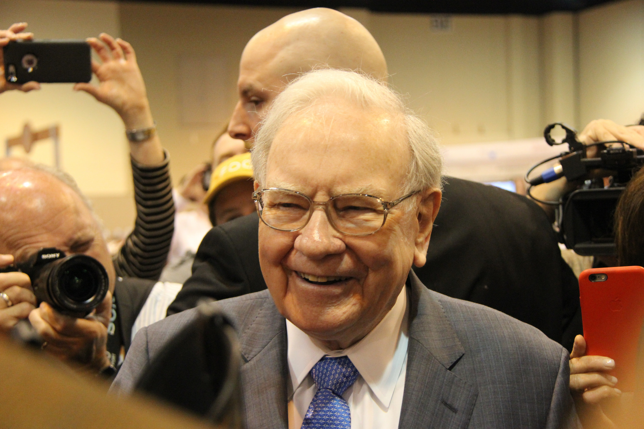 Warren Buffett Warren Buffett smiling at an event.