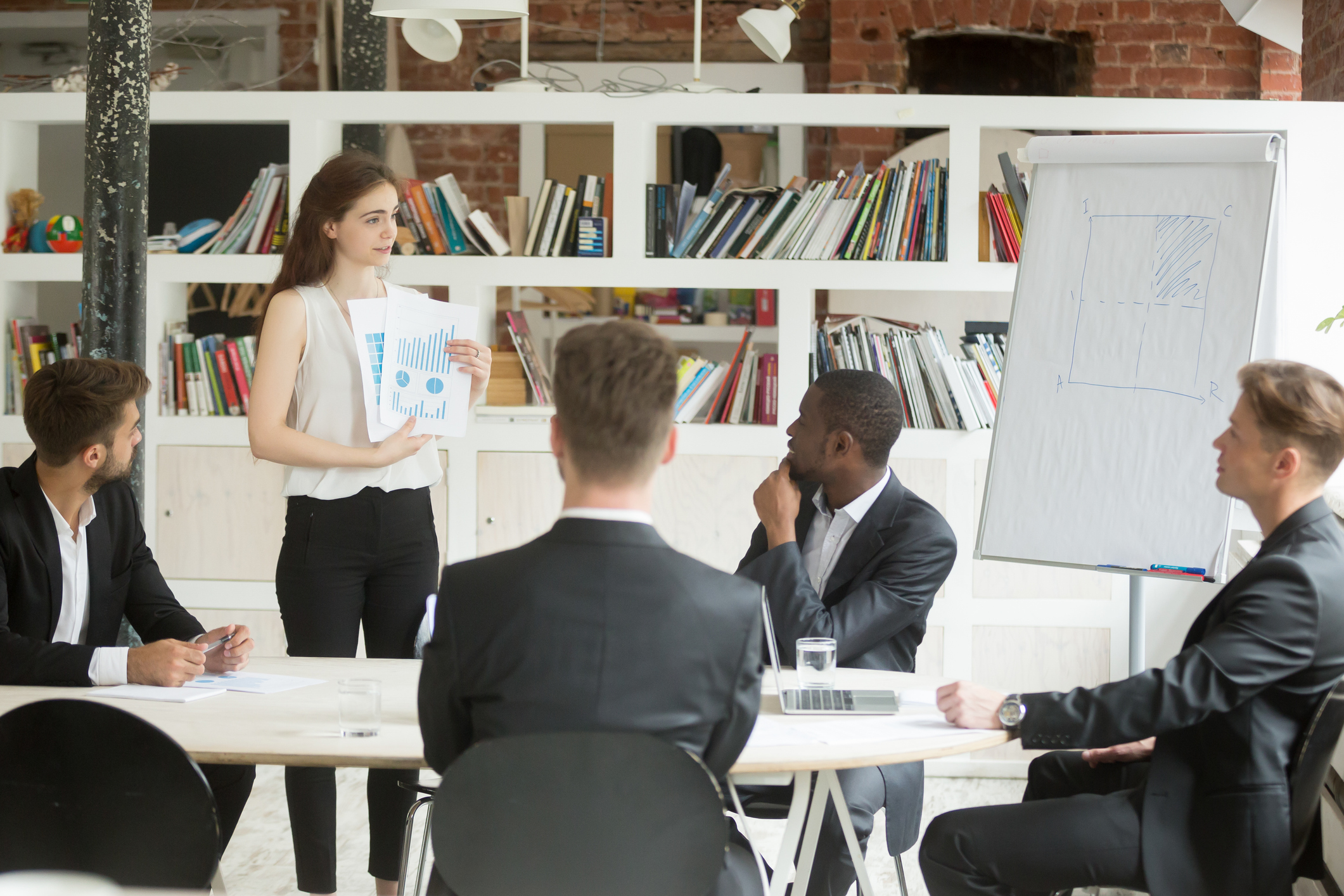 Businesswoman presenting design project to investors Businesswoman presenting design project to investors