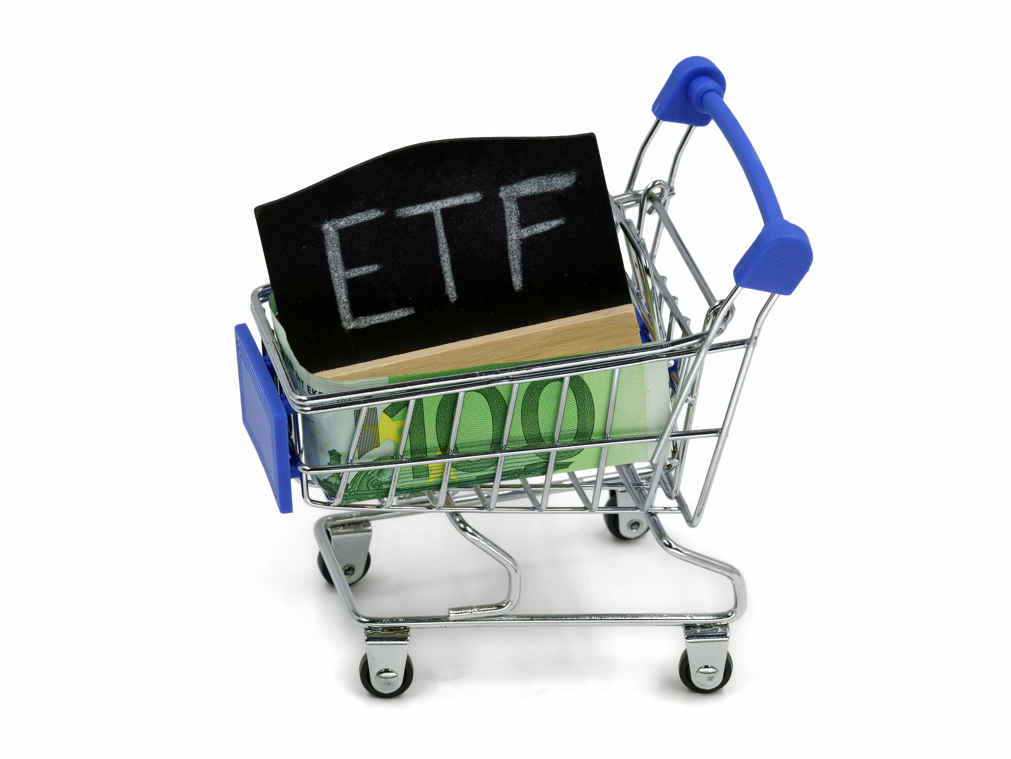 ETF investing concept in shopping basket ETF written on a chalkboard in a shopping basket.