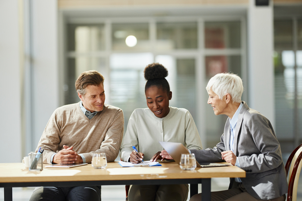 Financial advisor assisting clients. Financial advisor assisting clients.