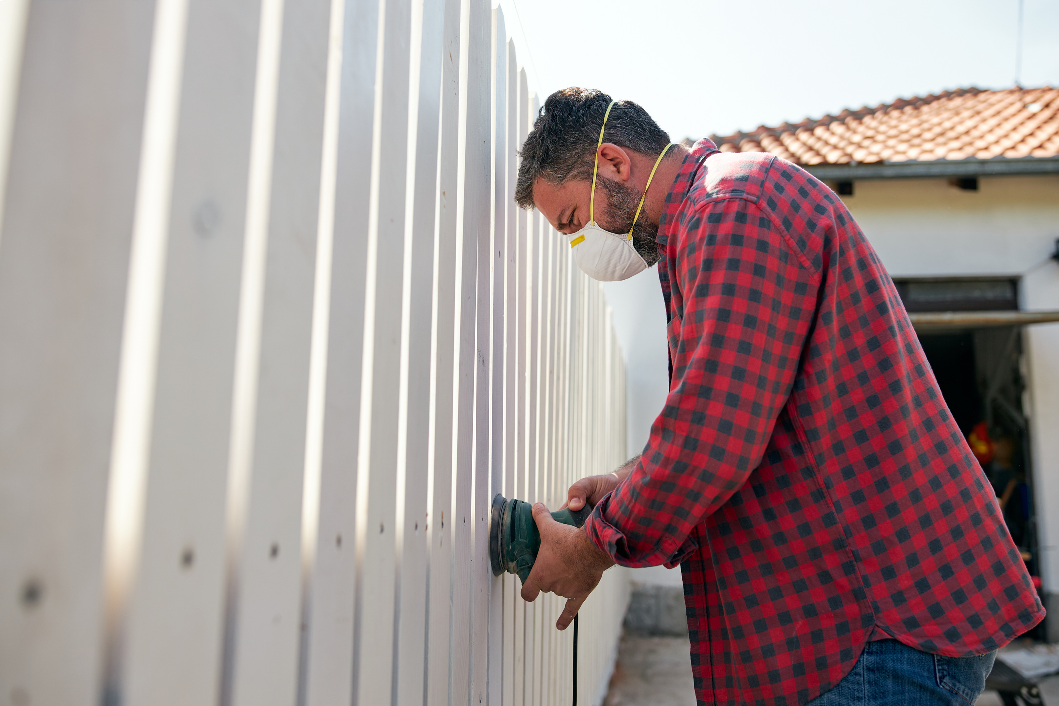 Person putting up fence. Person putting up fence.