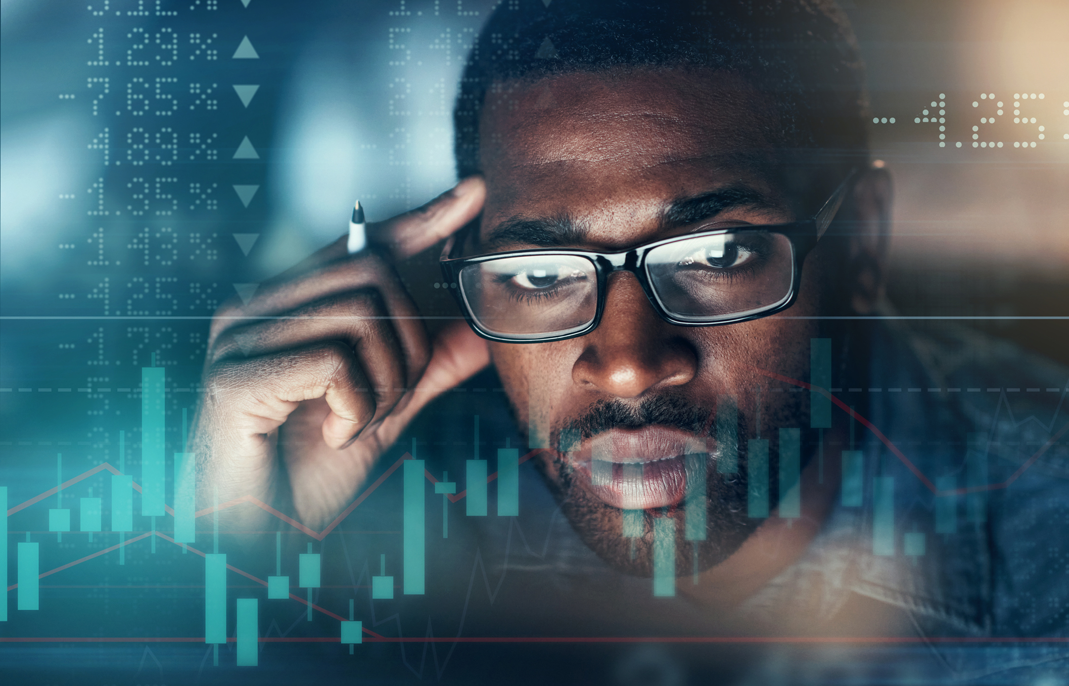 Man-Looking-at-stock-market-evaluating-ETFs Person looks at ups and downs of ETFs in the stock market.