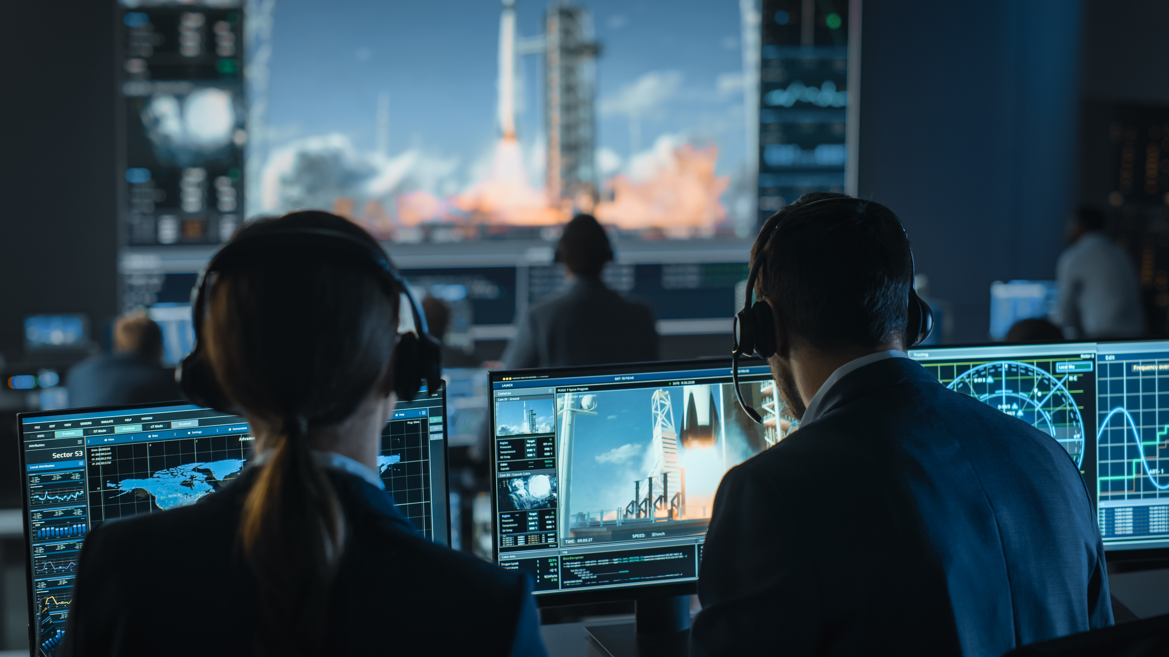 mission control in space Group of people in mission control center witness successful space rocket launch.