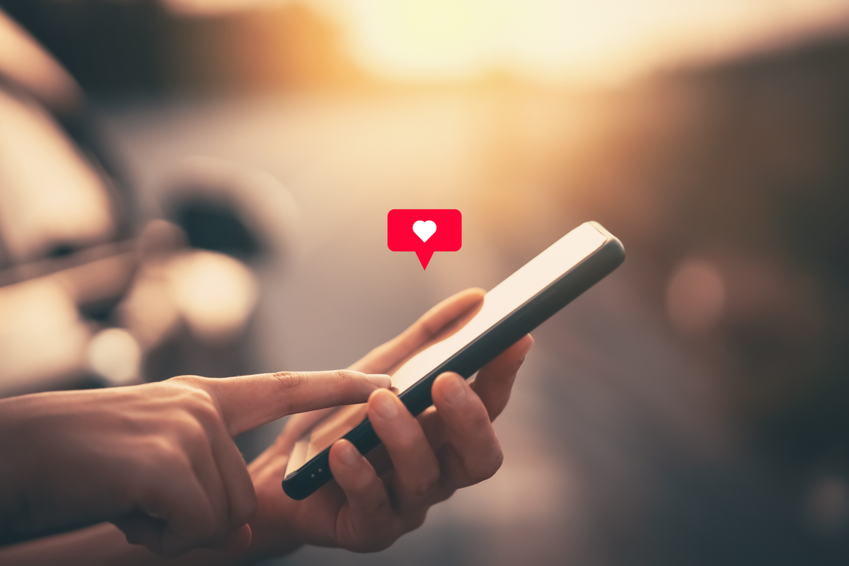 GettyImages-1340024049-1200x800-5b2df79 A person pressing the like button on their mobile phone.