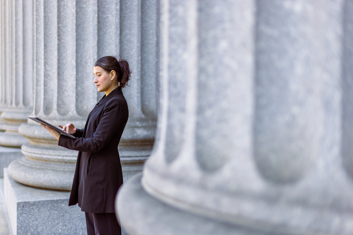Woman outside courthouse Woman outside courthouse