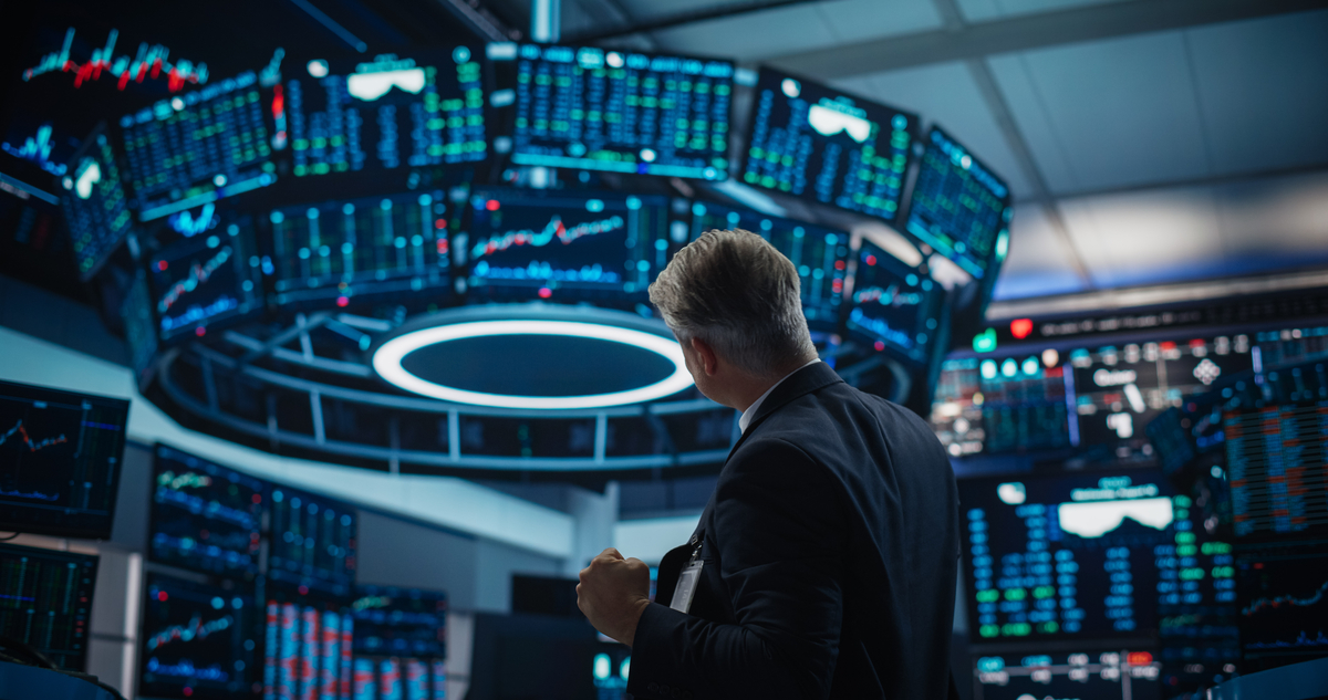 Business person looking at screens