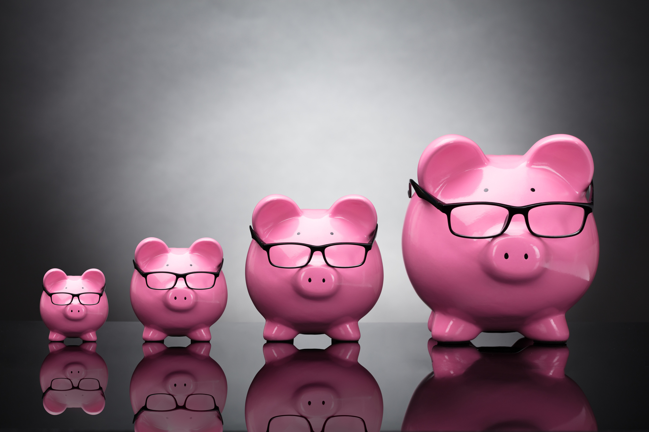 Getty - four piggy banks large small medium mid-cap.jpg Four piggy banks in ascending order by size.