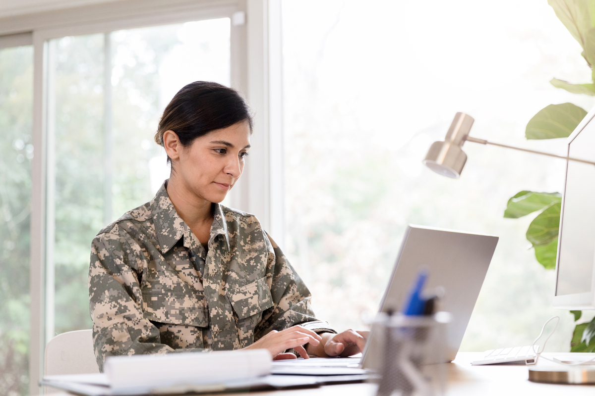Getty - military person laptop Soldier typing on their laptop.
