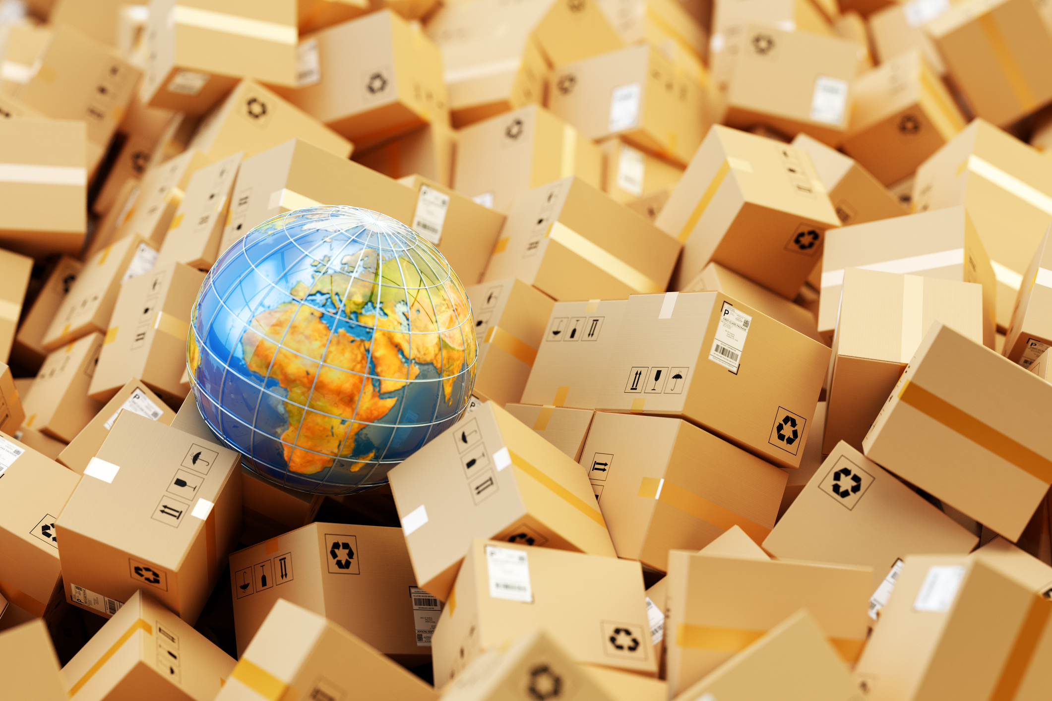 Global shipping A globe sits in a pile of packages.