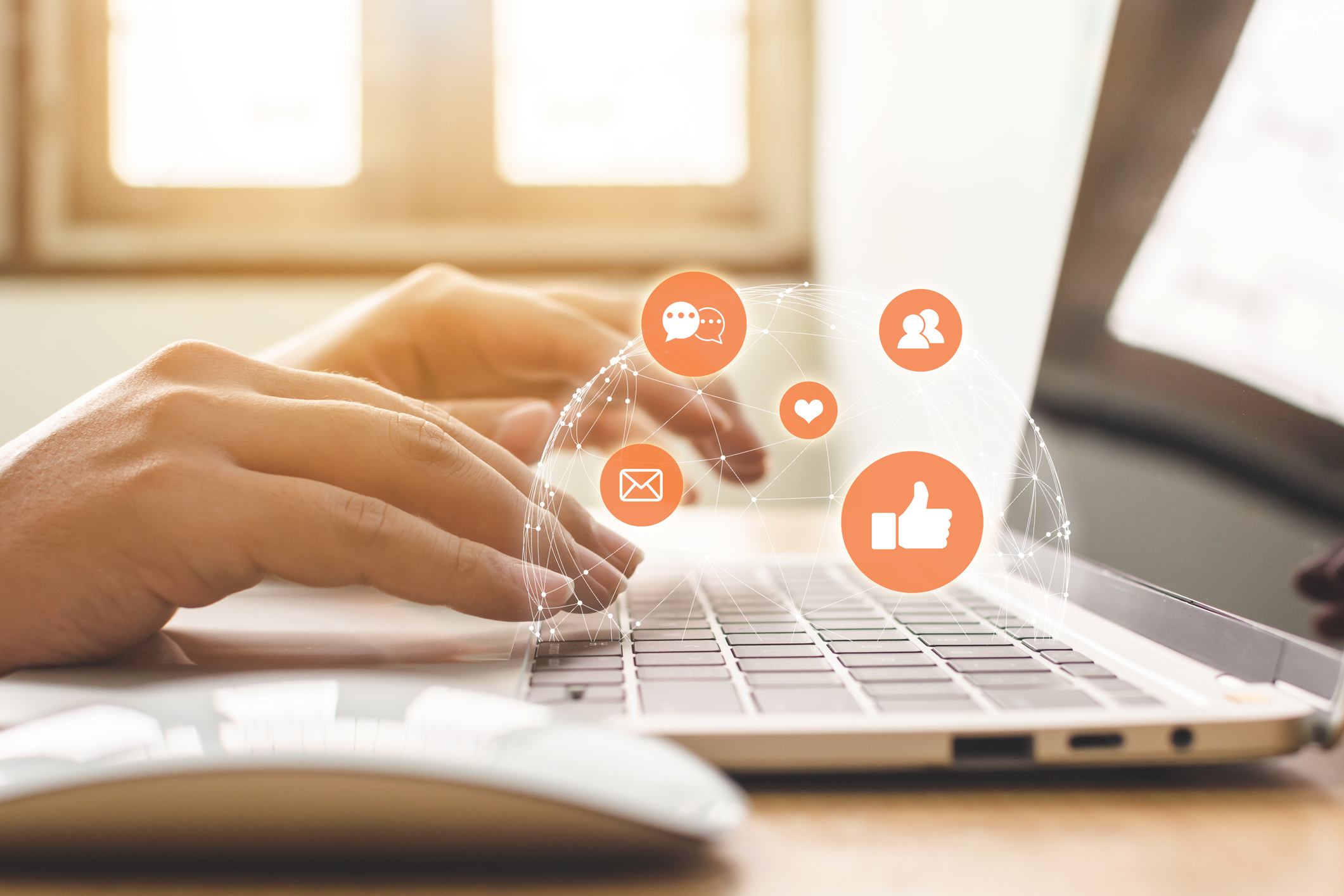 Hand on laptop surrounded by social media icons. Hand on laptop surrounded by social media icons.