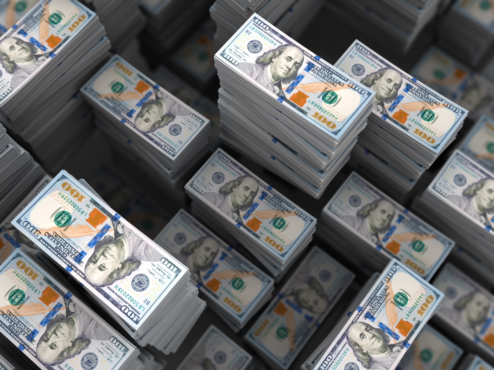 stacks of 100 dollar bills improbably tall stacks of hundred dollar bills