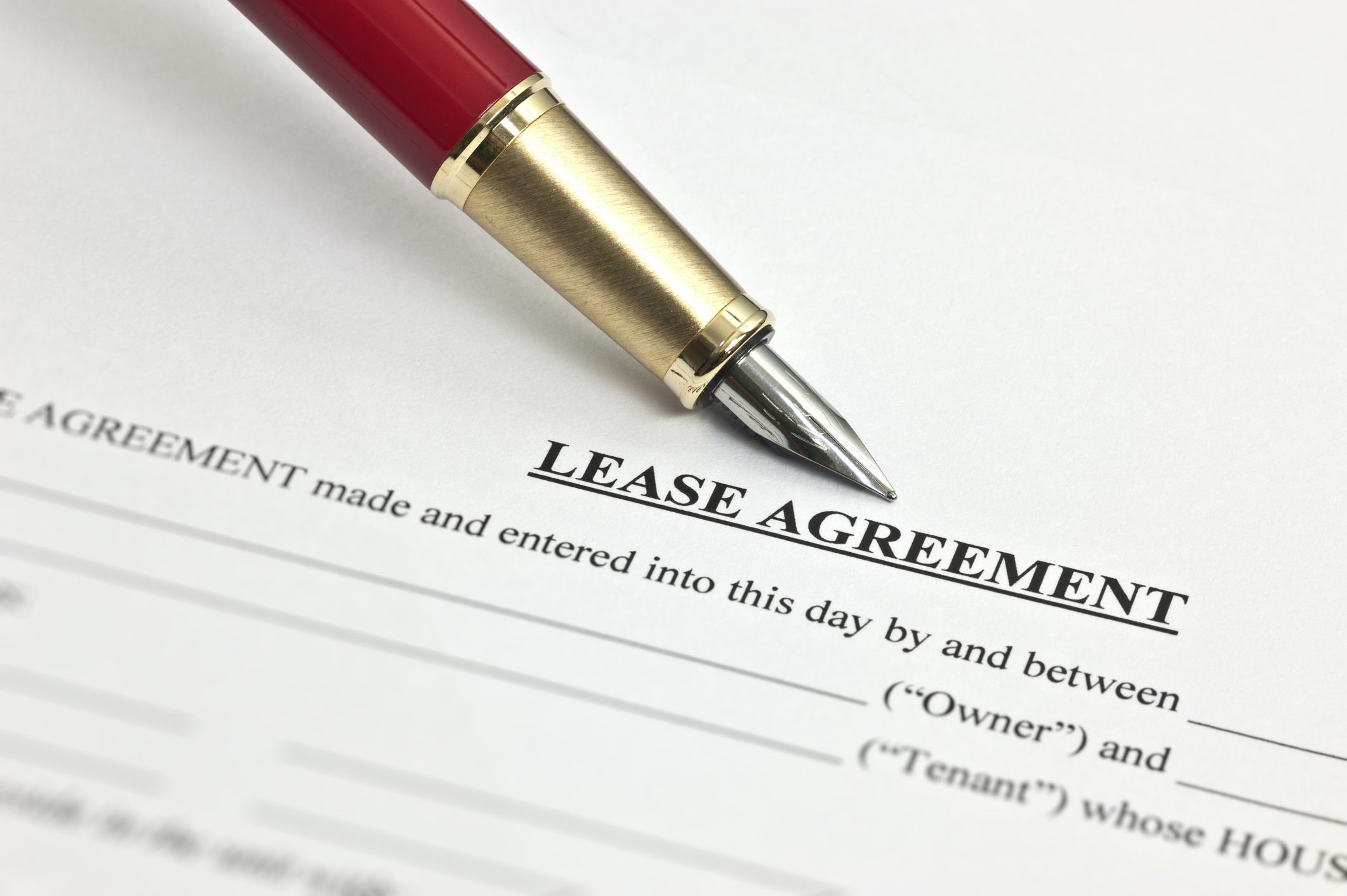 Lease agreement Pen lying atop a lease agreement.