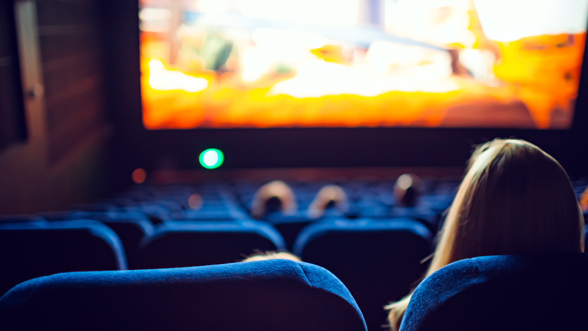People in a movie theater. People in a movie theater.