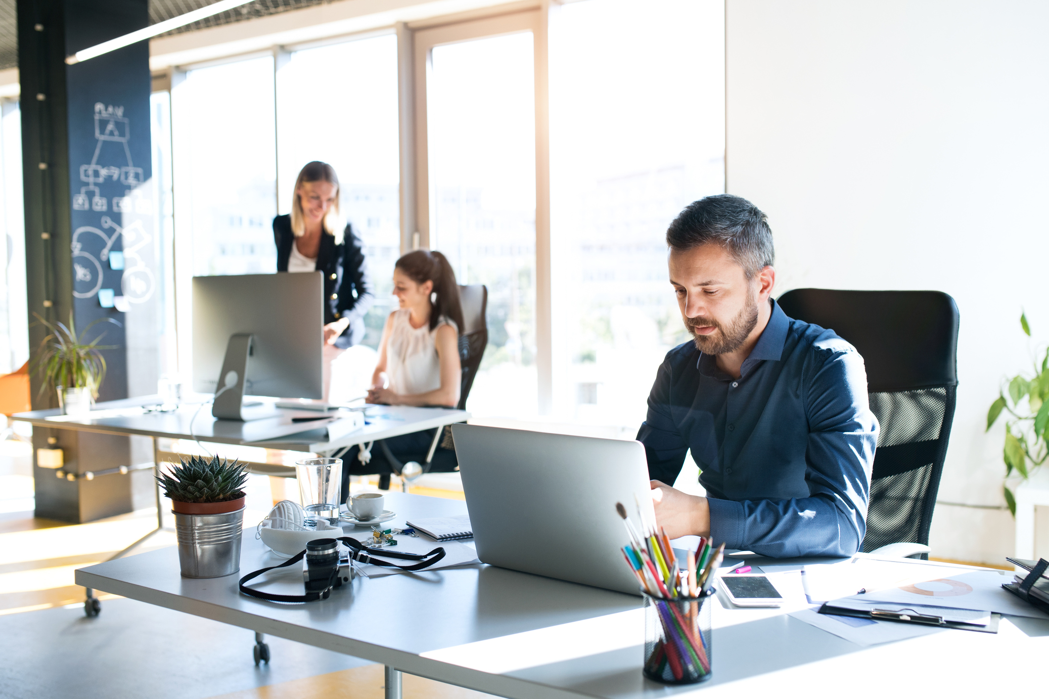 People working at desks in an office.