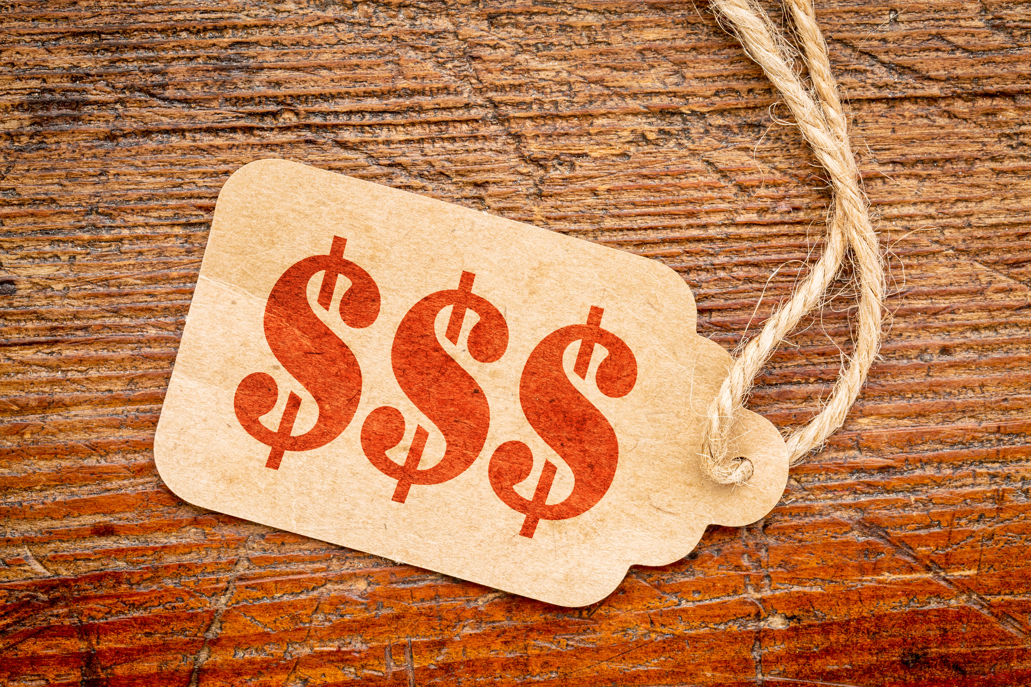 Price tag A price tag with three dollar symbols on it.