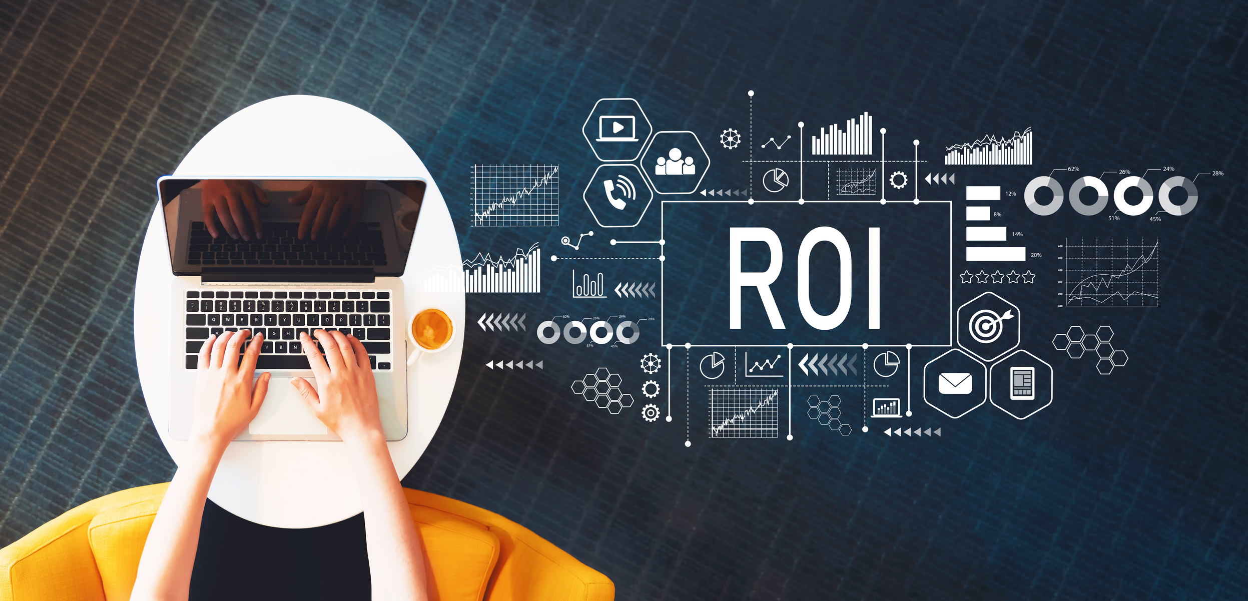 ROI and laptop hands Two hands typing on laptop near charts and the letters ROI.
