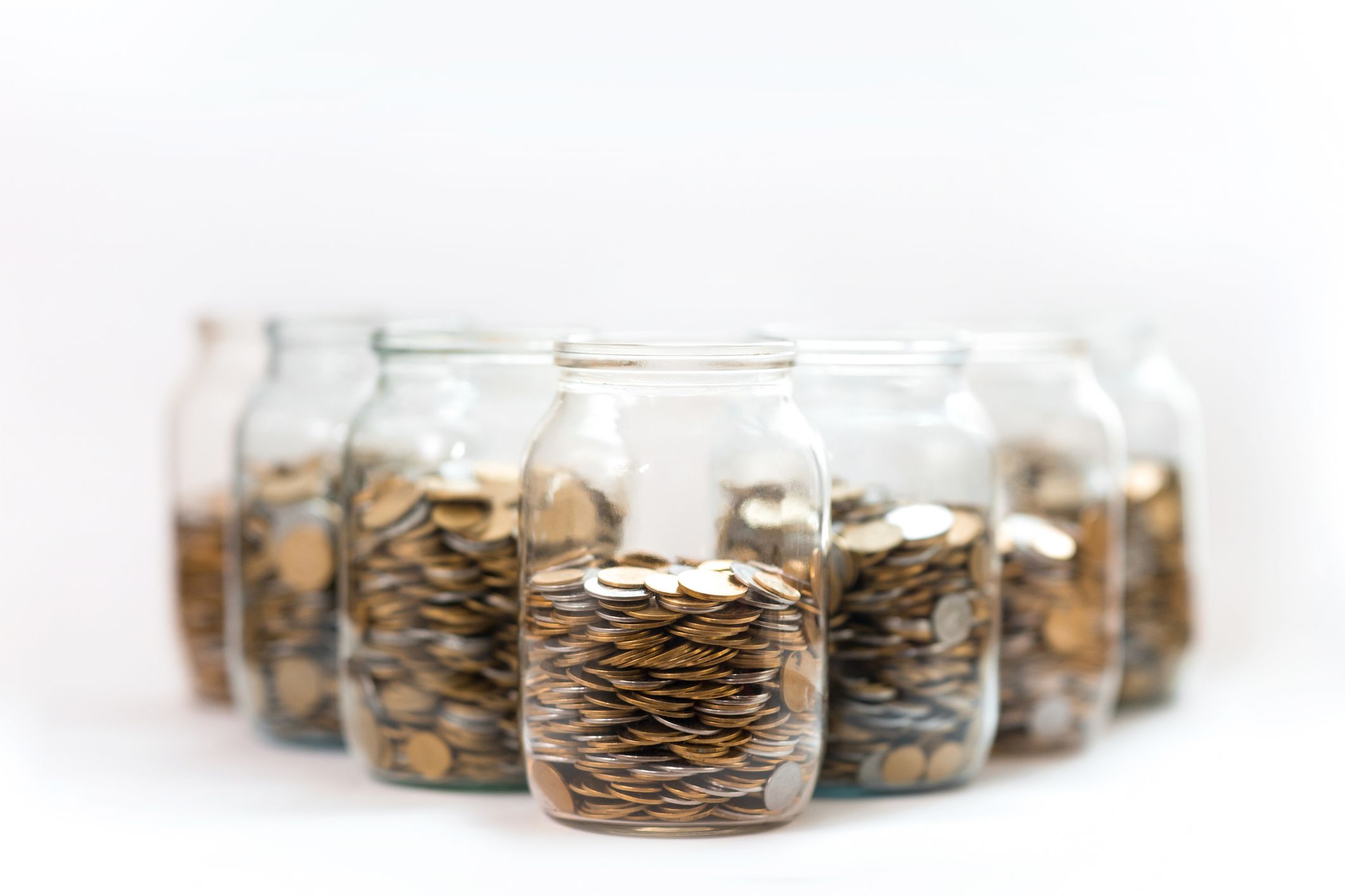 glass jars filled with coins
